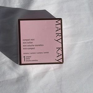 Mary Kay compact mini dark grey in color
